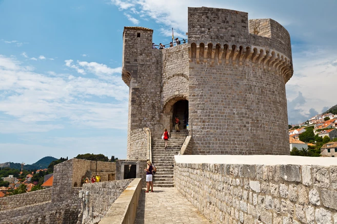 Walk between the thick walls of the mighty fortress which protected Dubrovnik for centuries